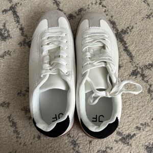 Dressy sneakers, never been worn, white with touches of black and brown.